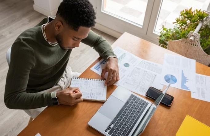 People working on laptops in a modern tech environment